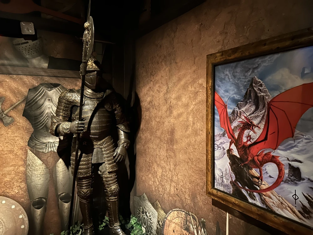 The suit of armor and dragon painting in the armory